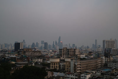 High angle view of buildings in city against sky