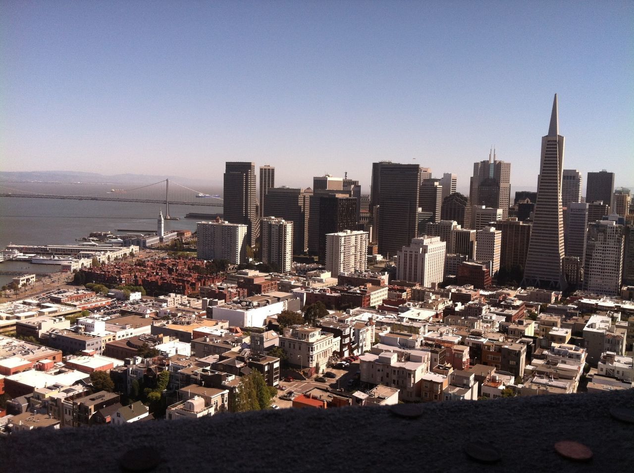 building exterior, architecture, built structure, city, cityscape, clear sky, crowded, sea, skyscraper, residential district, high angle view, tower, tall - high, water, residential building, copy space, urban skyline, residential structure, city life, office building