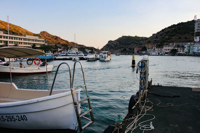 Scenic view of sea by buildings against sky