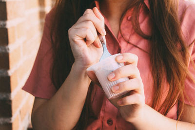 Close-up of woman holding hands