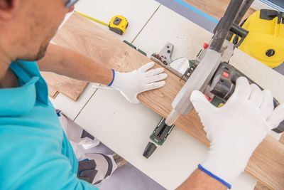 High angle view of carpenter working on table in workshop