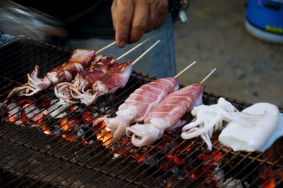 High angle view of meat on barbecue grill