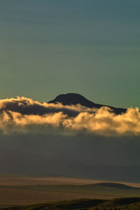 Scenic view of mountains against sky during sunset