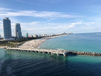 View of bridge over sea against buildings