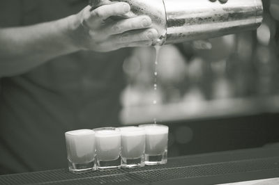 Close-up of hand holding glass of water