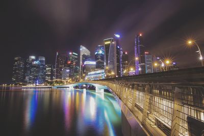 Illuminated city at waterfront