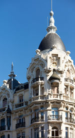 Low angle view of building against blue sky