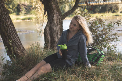 Portrait of young woman using mobile phone