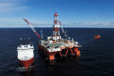 Ship in sea against blue sky