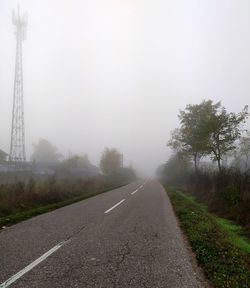 Road against sky during foggy weather