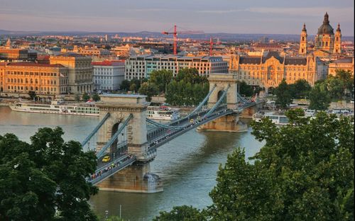 High angle view of chain bridge over danube river against sky in city