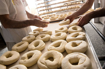 Bakers preparing dough for bagels