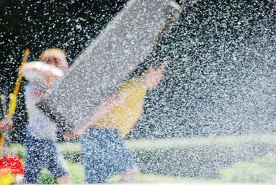 Blurred motion of water splashing in rain