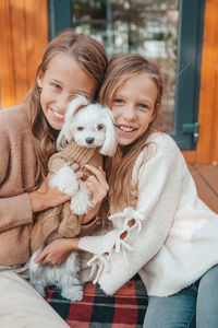 Portrait of happy woman with dog