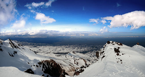 Scenic view of snowcapped mountains against sky