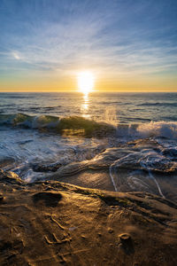 Scenic view of sea against sky during sunset