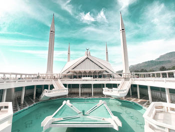 View of pier on sea against cloudy sky