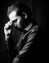 Portrait of young man looking away