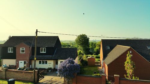 Houses against clear sky