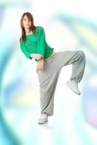 Young woman standing against blurred background