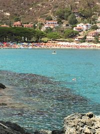 Scenic view of sea by town