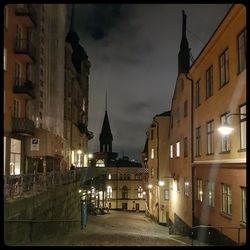 Illuminated city against sky at night