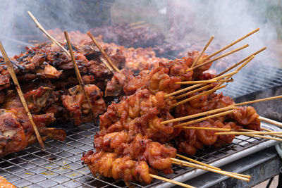 High angle view of meat on barbecue grill