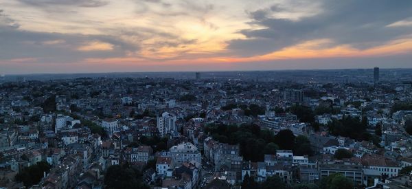 High angle view of city at sunset