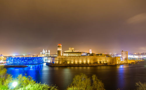 Illuminated buildings in city at night