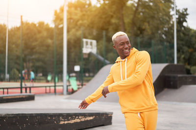 Portrait of smiling man in city