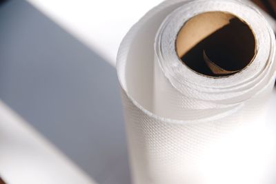 High angle view of rolled up papers on table