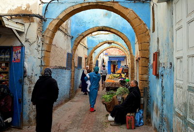 Rear view of people enjoying on building