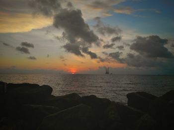 Scenic view of sea against sky during sunset