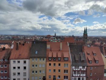 Buildings in city against sky