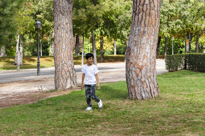 Young boy alone. having fun in a park.