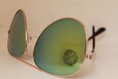 Close-up of sunglasses on table