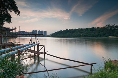 Scenic view of river against sky during sunset