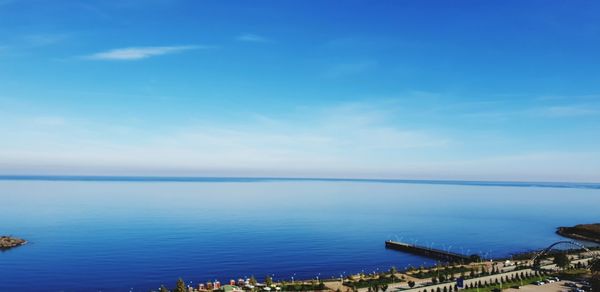 Scenic view of sea against blue sky