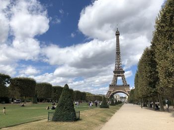 View of tower in park against cloudy sky