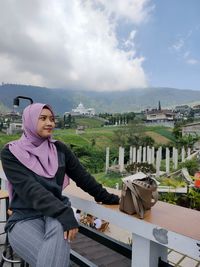 Portrait of woman standing against sky and view in montain tawangmangu karang anyar solo indonesia