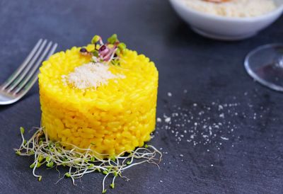 Close-up of yellow served in bowl on table