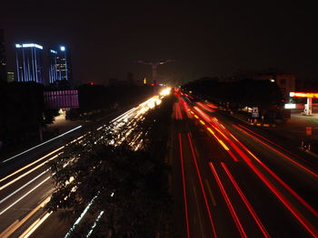 High angle view of light trails on road at night