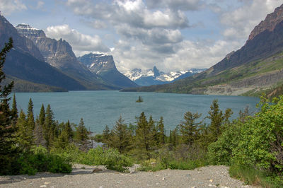 Scenic view of lake and mountains against sky