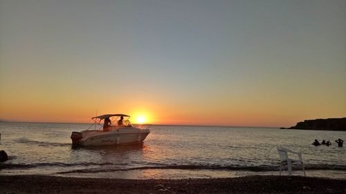 Scenic view of sea against clear sky during sunset