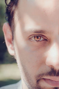 Close-up portrait of mid adult man with brown eyes