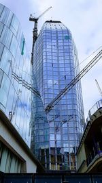 Low angle view of skyscrapers against sky