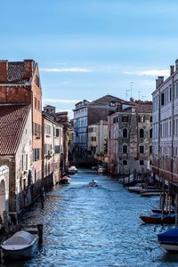 Canal passing through city buildings