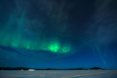 Low angle view of dramatic aurora sky at night