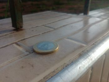 High angle view of coins on table