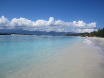 Scenic view of sea against blue sky